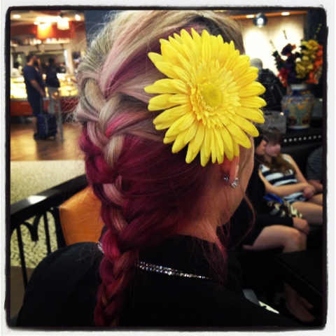 A flower blooming in the industrial jungle